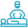 A blue icon of a person lying down with another person standing over them, representing a medical or therapeutic examination.